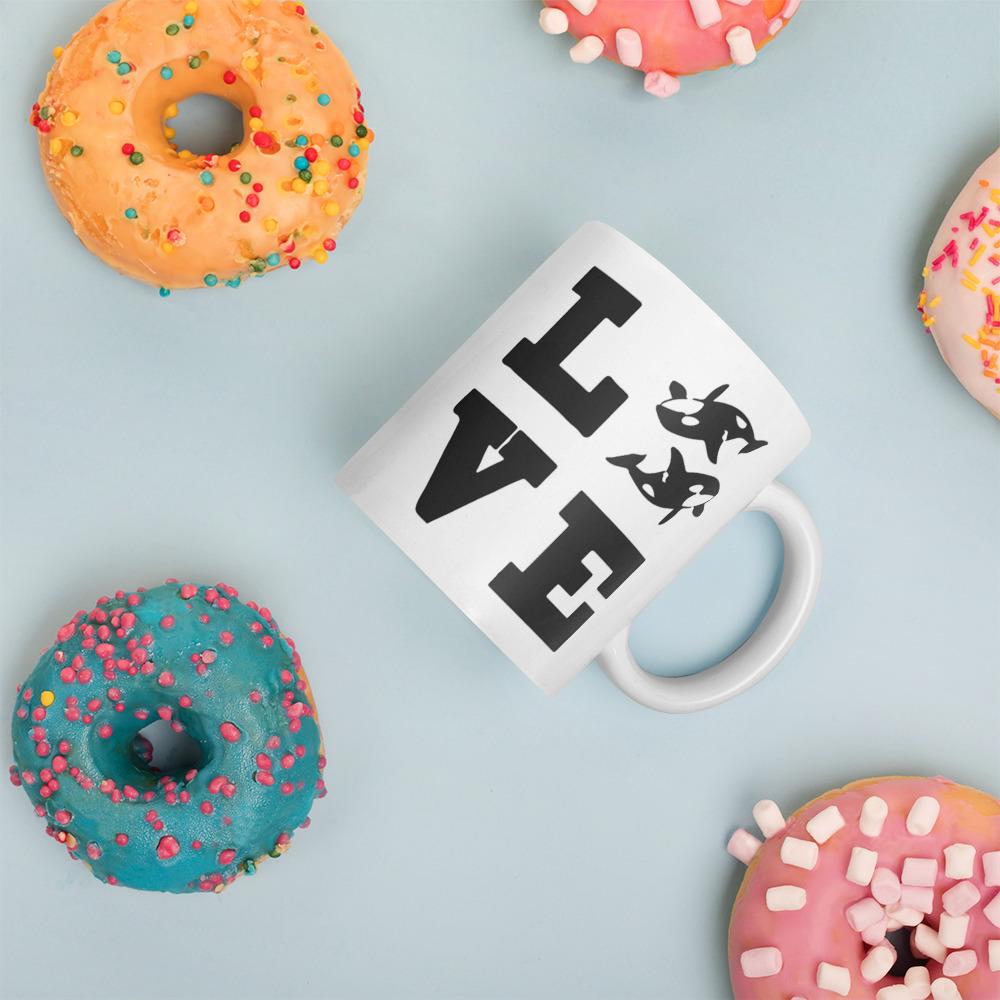 Orca Shop: Love Orca coffee mug amongst donuts by Wildlife Collections.